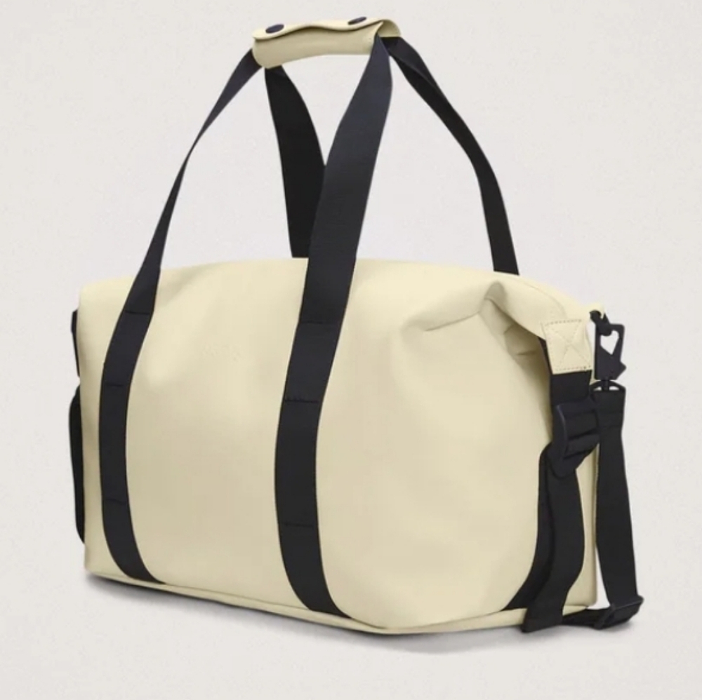 Rains Cream and Black Travel Bag